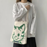 A fabulous mix of Japanese manga and American pop art styles, Japanese illustrator Osamu Harada created some of the most iconic kawaii designs of the 1980s. These Japanese Pop Art Cat Face Tote Bag by Osamu Goods feature his wholesome but edgy designs in a fabulous larger sized canvas tote with silkscreened happy cat face, one of his most famous iconic designs.